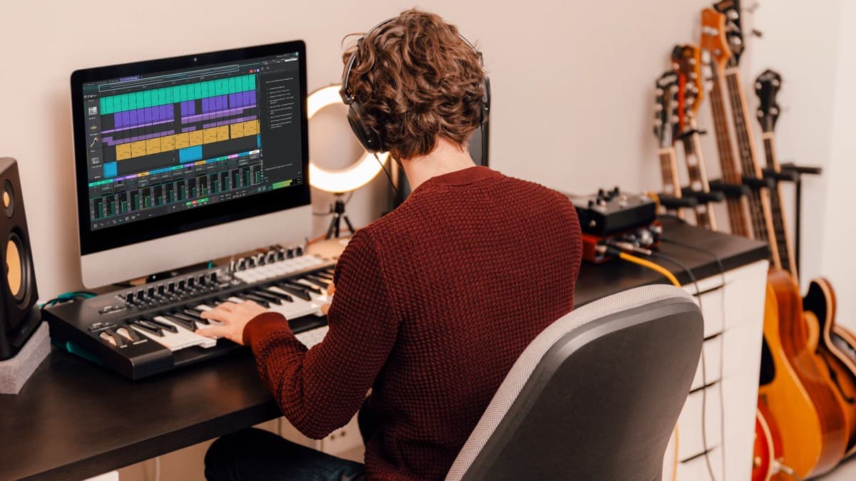 Tracktion Waveform Free 14 DAW interface on a home studio screen